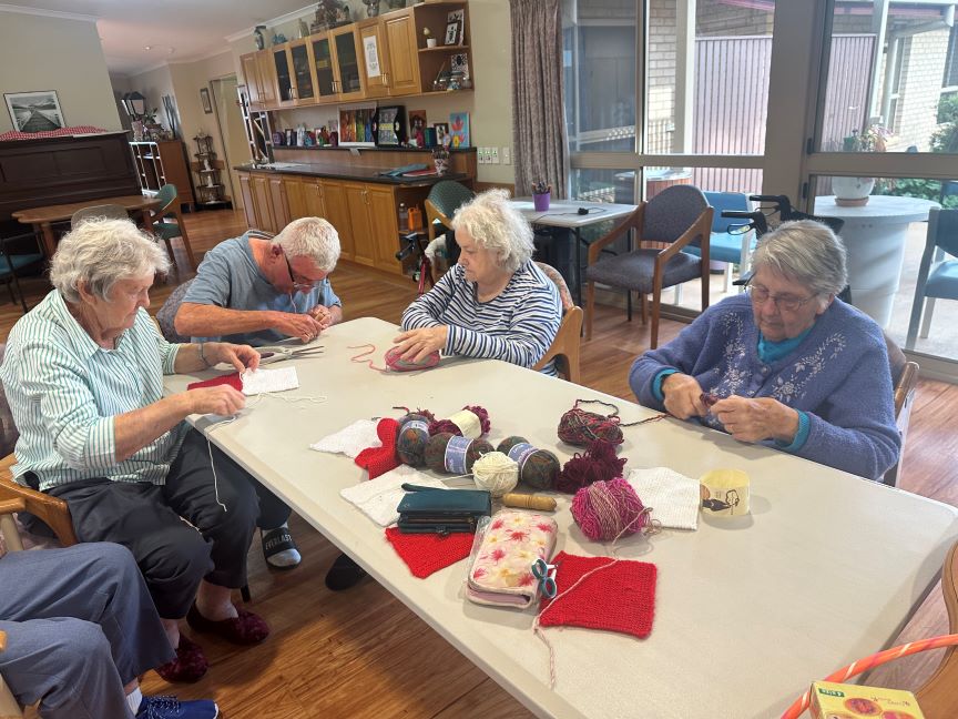 making pompoms for the mixed berry jar